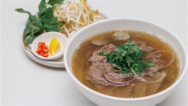 Try this tasty beef pho - featuring rice noodles with tender beef slices in an aromatic and hearty beef broth with toppings.