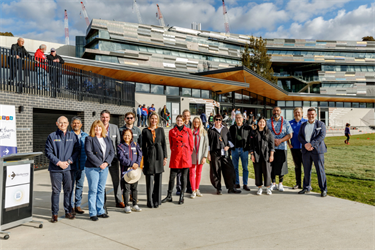 Group gather outside the new Henry Turner South Reserve Pavilion to celebrate the opening.