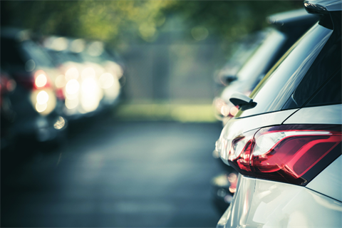 Rows of cars parked in a parking lot